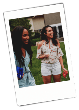 Instax picture of two women at an outdoor picnic