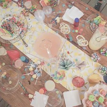 Table of decorations and candy at a kid's birthday party