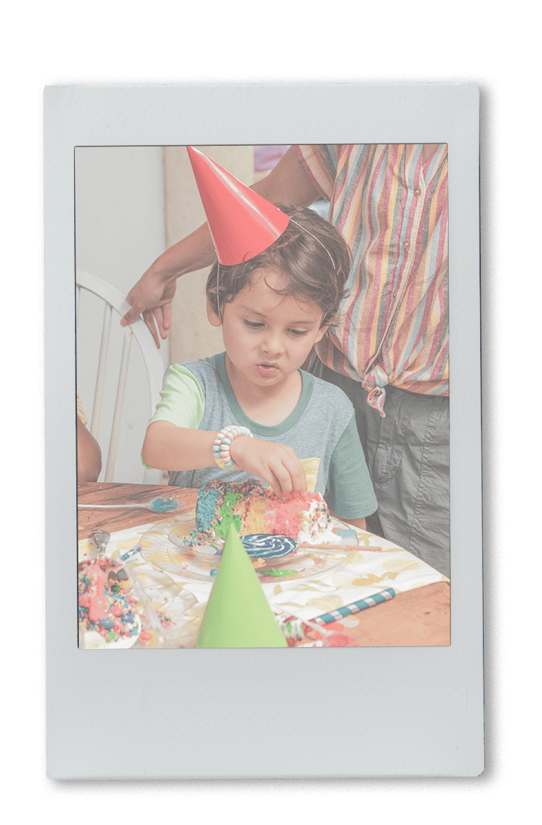 Little boy eating birthday cake on a Chinet Crystal plate