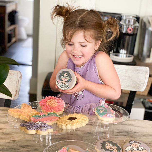 Little girl holding a cookie