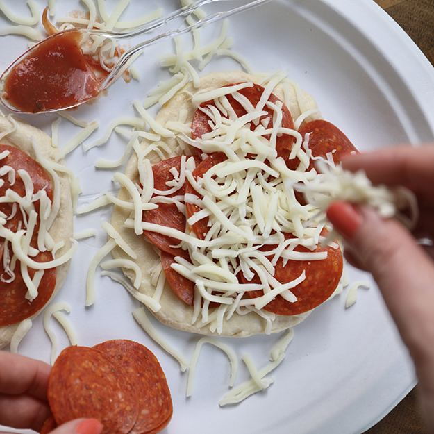 Preparing waffle iron pizza