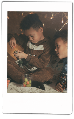 Instax picture of a family playing in a homemade fort