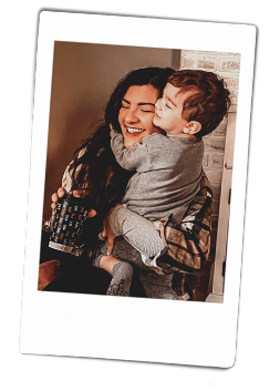Instax picture of a little boy hugging his Mother