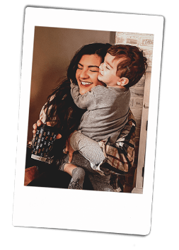 Instax picture of a little boy hugging his Mother