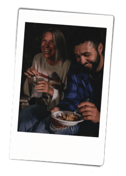 Instax picture of a man eating dessert out of a Chinet Classic bowl