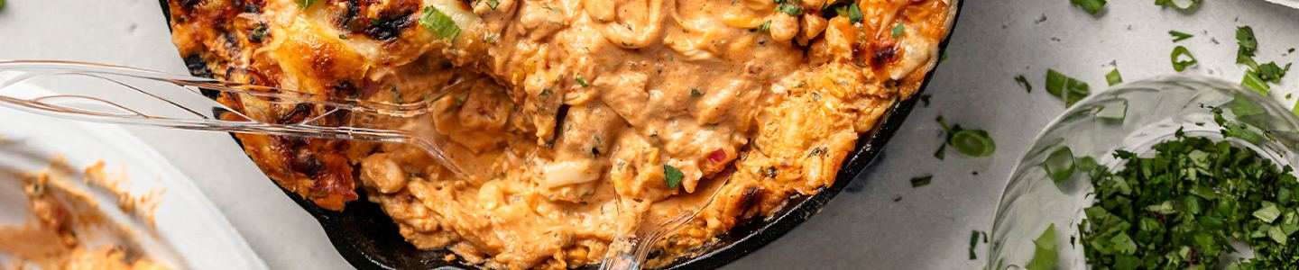 BBQ chicken pizza dip in a cast iron pan