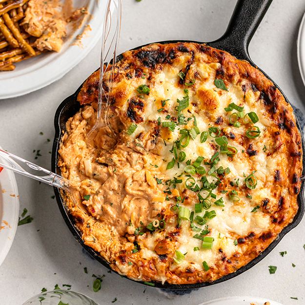BBQ chicken pizza dip in a cast iron pan