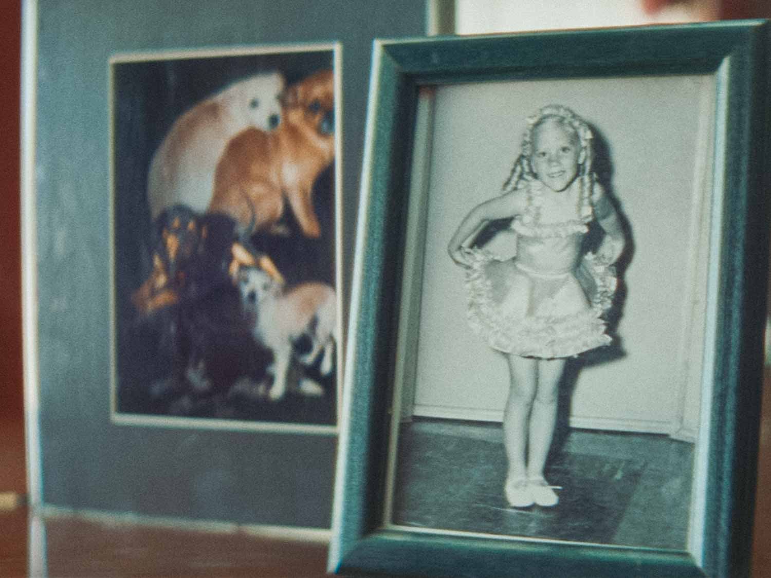 Framed photo of a young girl in ballet shoes and a dance costume