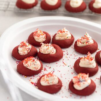 Red velvet thumbprint cookies served on a Chinet Classic plate