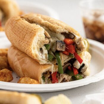 Chicken and mushroom cheesesteak served on a Chinet Classic plate