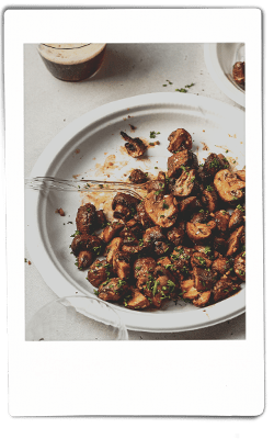 Instax picture of air fryer mushrooms served on a Chinet Classic plate