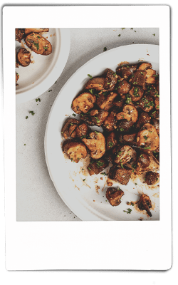 Instax picture of air fryer mushrooms served on a Chinet Classic plate