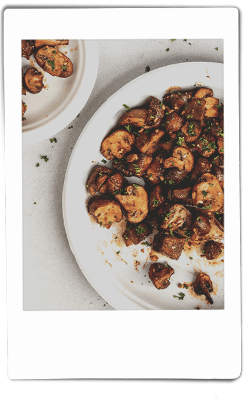 Instax picture of air fryer mushrooms served on a Chinet Classic plate