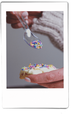 Instax picture of sprinkles dropping on a sugar cookie