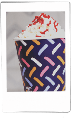 Instax picture of a red velvet lattes served in Chinet Comfort cup