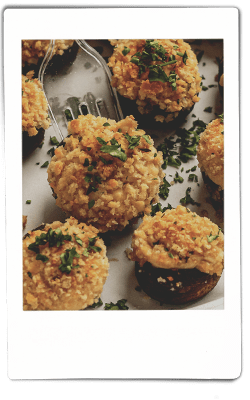 Instax picture of stuffed mushrooms served on a Chinet Classic plate
