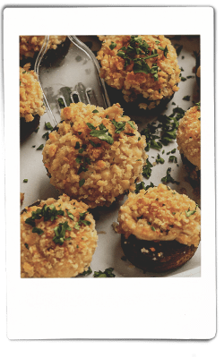 Instax picture of stuffed mushrooms served on a Chinet Classic plate