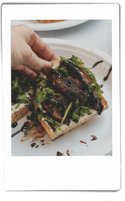 Instax picture of mushroom toast served on Chinet Classic plate