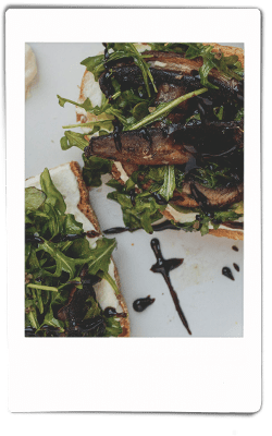 Instax picture of mushroom toast served on Chinet Classic plate