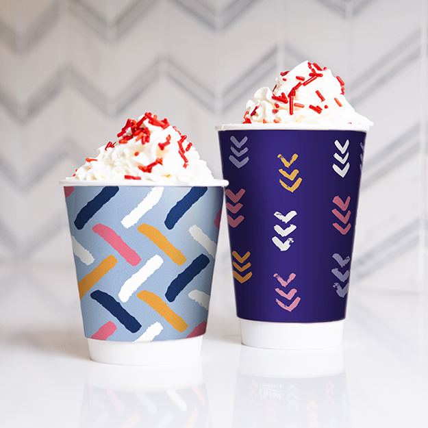 Red velvet hot chocolate with whip cream in chinet comfort cups