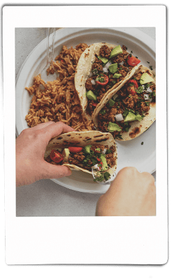 Ground mushroom tacos with rice on Chinet Classic® plate