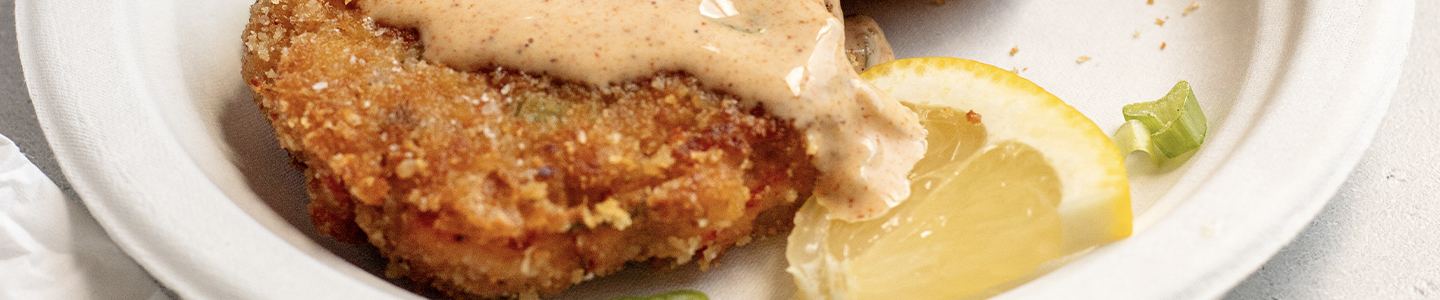 Crawfish cakes served on a Chinet Classic plate