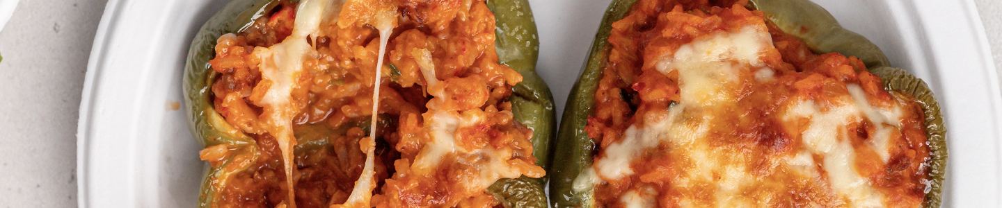 Crawfish stuffed bell peppers served on a Chinet Classic plate