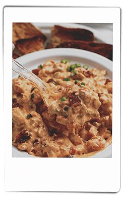 Instax picture of crawfish dip served in a Chinet Classic bowl
