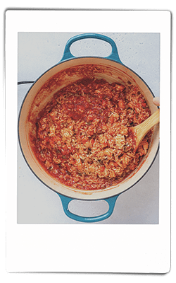 Crawfish jambalaya sauteeing in a pan