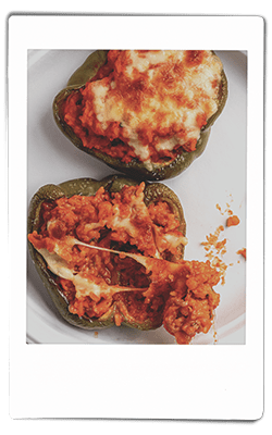 Instax crawfish stuffed bell peppers served on a Chinet Classic plate