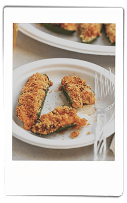 Instax picture of crawfish-stuffed jalapeno peppers served on a Chinet Classic plate