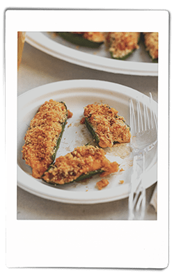 Instax picture of crawfish-stuffed jalapeno peppers served on a Chinet Classic plate