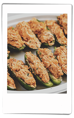 Instax picture of crawfish-stuffed jalapeno peppers served on a Chinet Classic plate