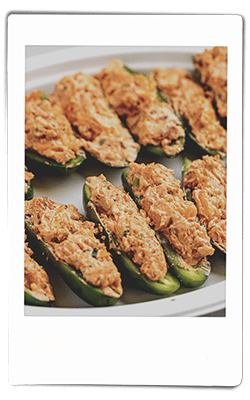 Instax picture of crawfish-stuffed jalapeno peppers served on a Chinet Classic plate