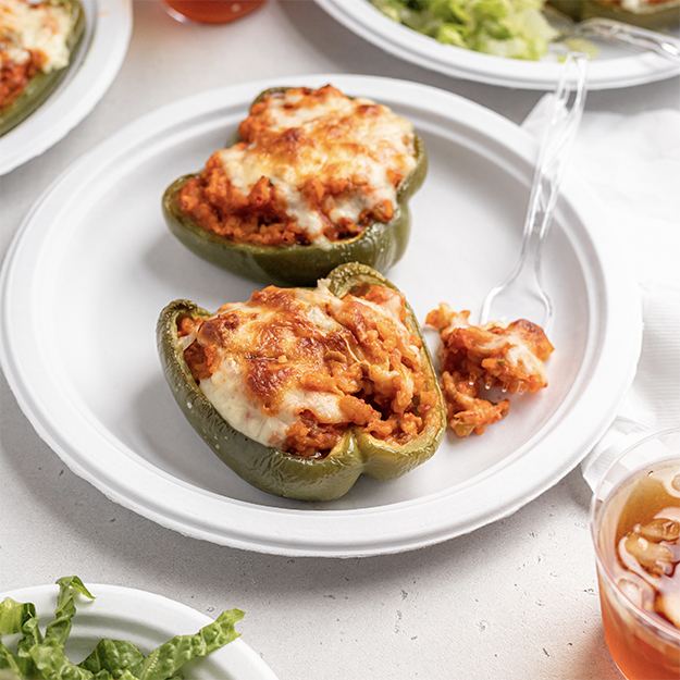 Crawfish stuffed bell peppers served on a Chinet Classic plate