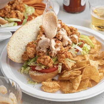 Crawfish po-boy served on a Chinet Classic plate