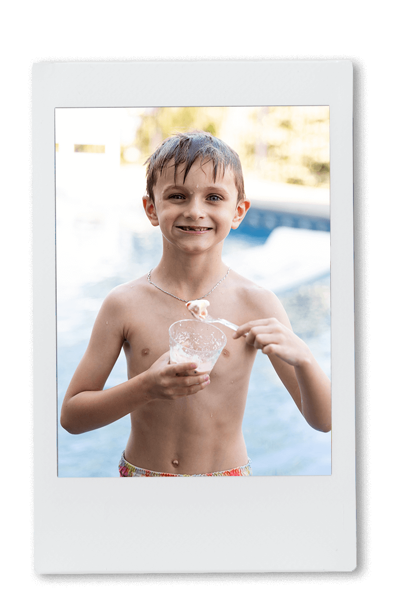 Instax of a young boy eating ice cream