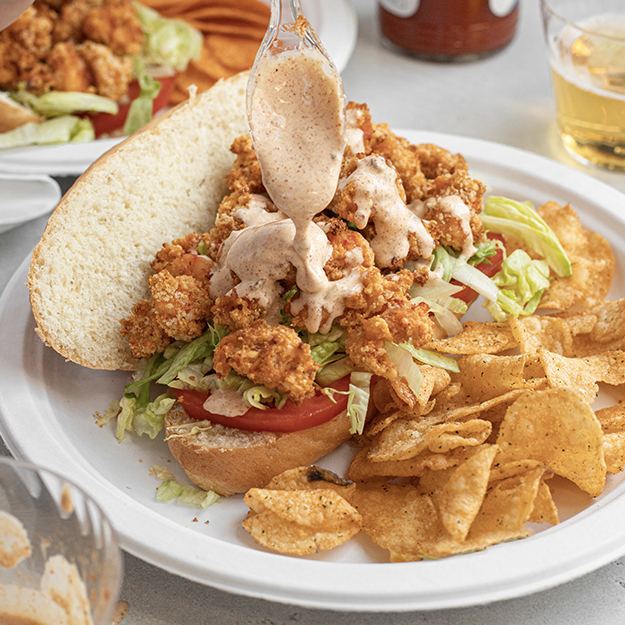 Crawfish po boy served on a Chinet Classic plate