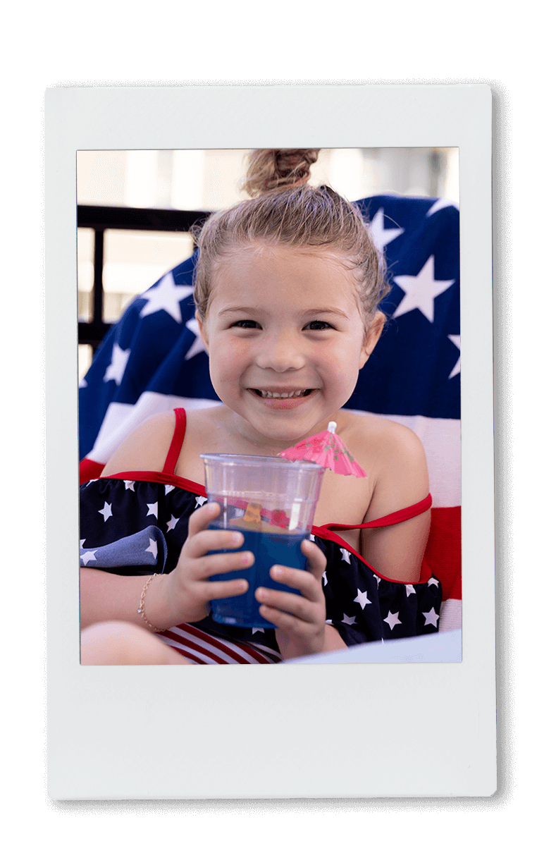 Instax picture of a young girl eating a Jell-O cup