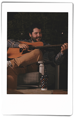 Instax picture of a man playing a guitar