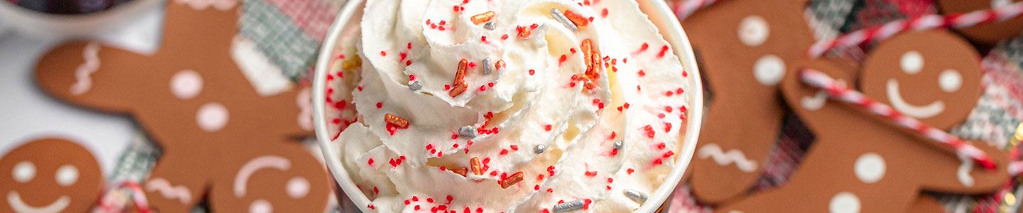 Gingerbread lattes served in Chinet Comfort Cups with whipped cream on top