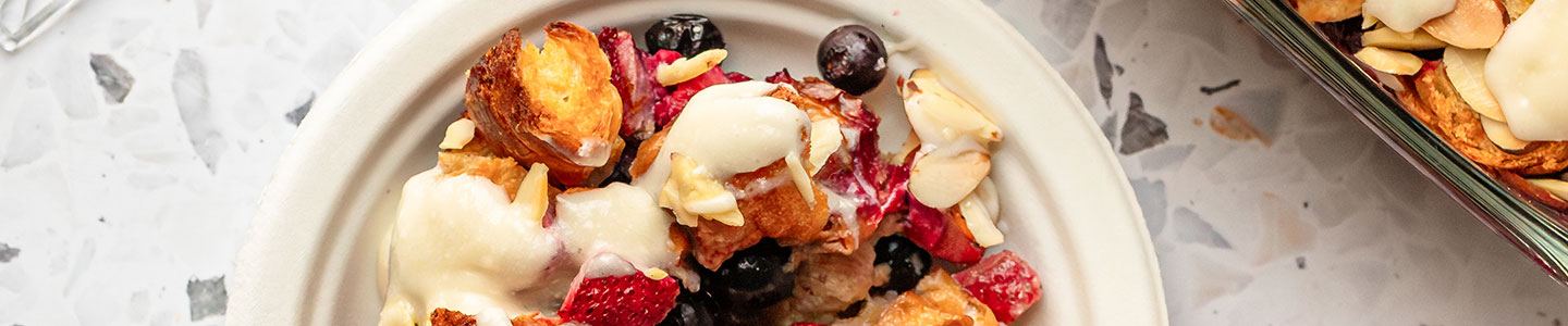 Slice of mixed berry croissant bake served on a Chinet Classic dessert plate