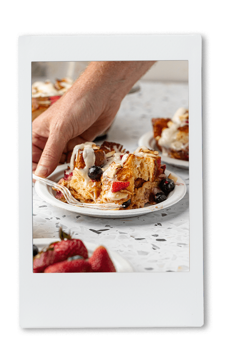 Instax picture of a slice of mixed berry croissant bake served on a Chinet Classic dessert plate