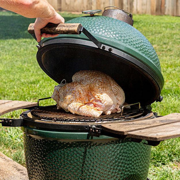 A turkey smoking in a smoker BBQ