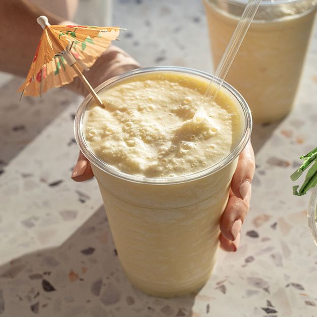 Pina colada served in a Chinet Classic Recycled Clear Cup