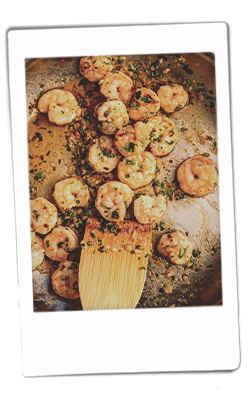 Instax picture of Baked parmesan risotto with lemon garlic shrimp served on Chinet Crystal plate