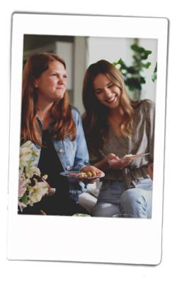 Instax picture of two women lauighing