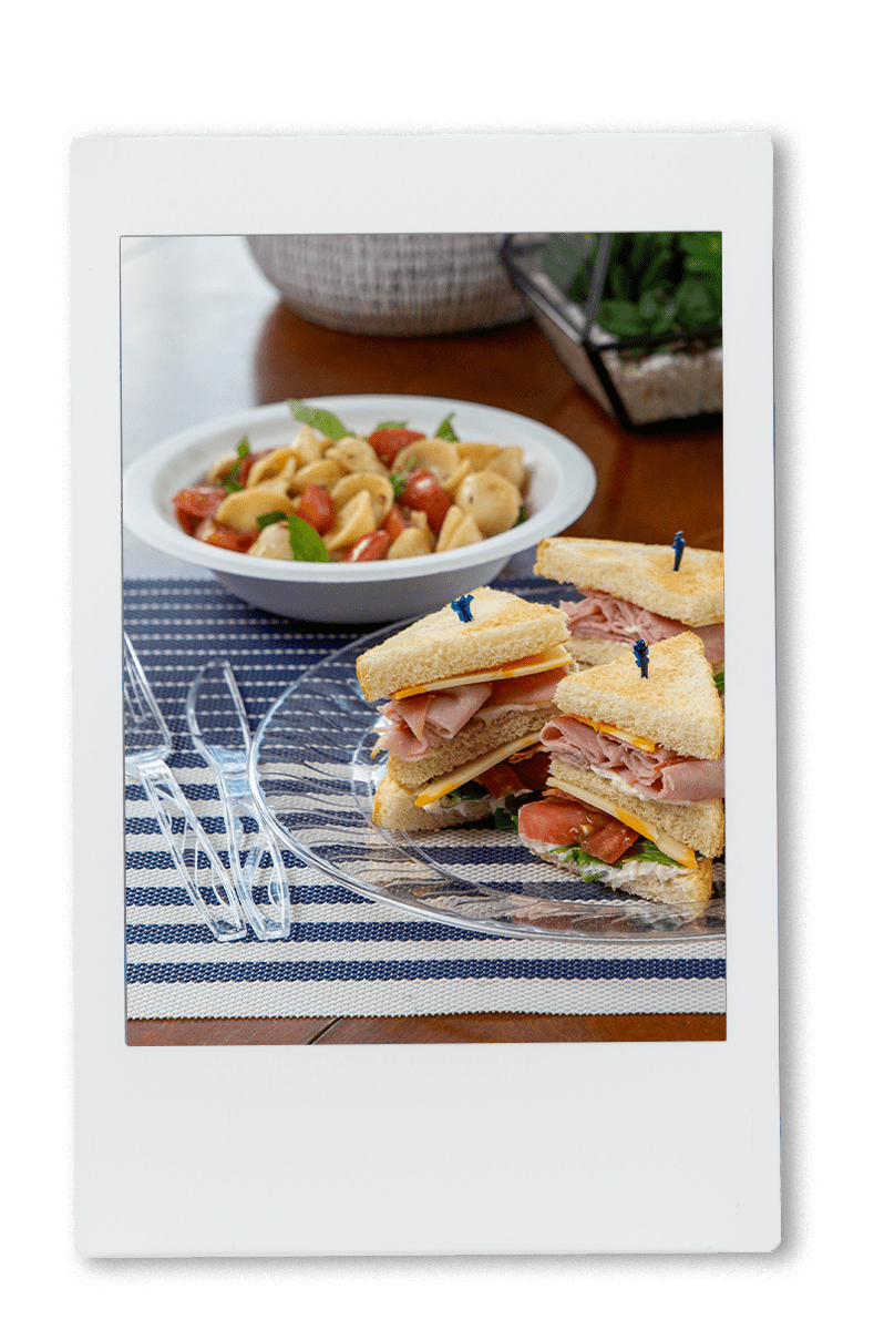 Table setting of snacks and sandwhiches on chinet products