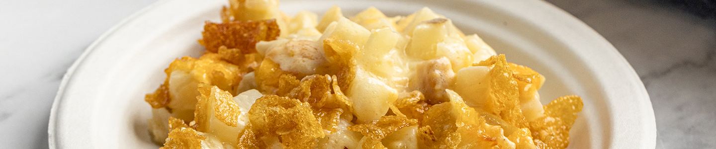 Cheesy potato bake served on a Chinet paper plate