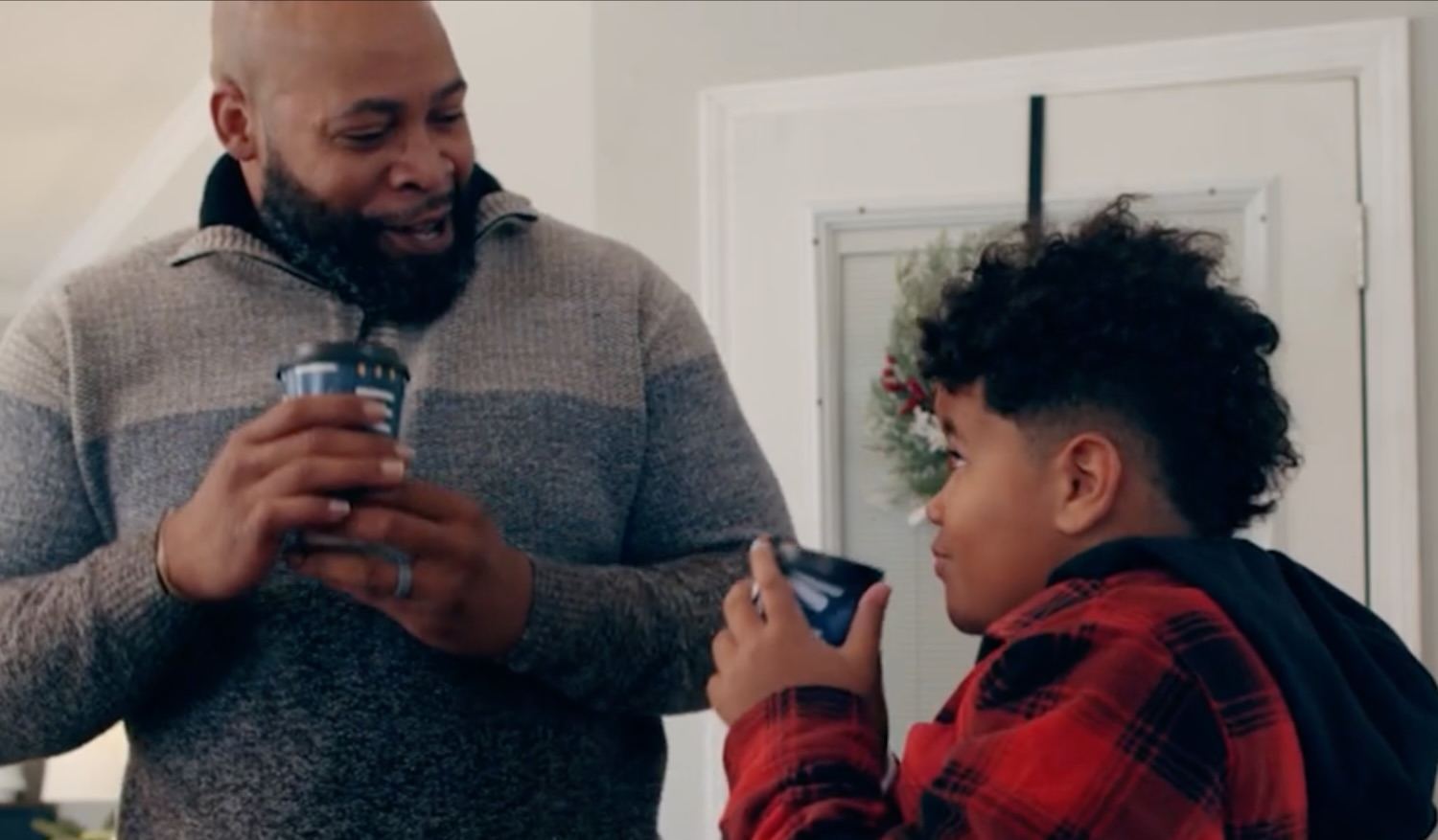 A man and tween enjoy beverages from Chinet Comfort cups